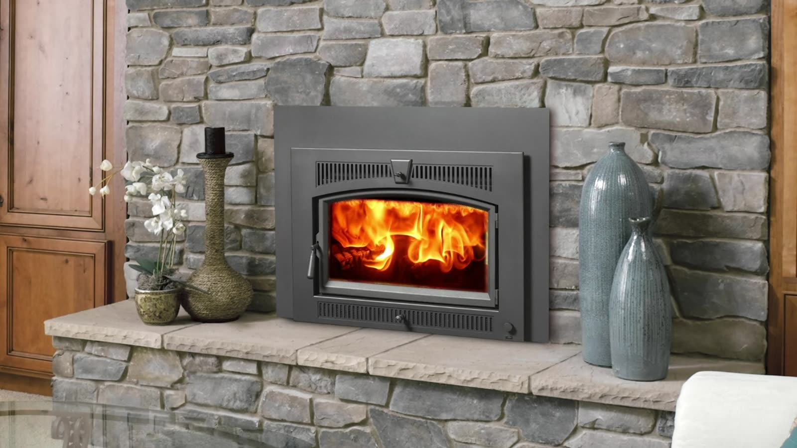 Custom stone fireplace installed by Village Hearth