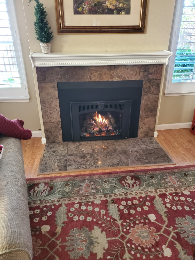 Classic white mantel with tile surround