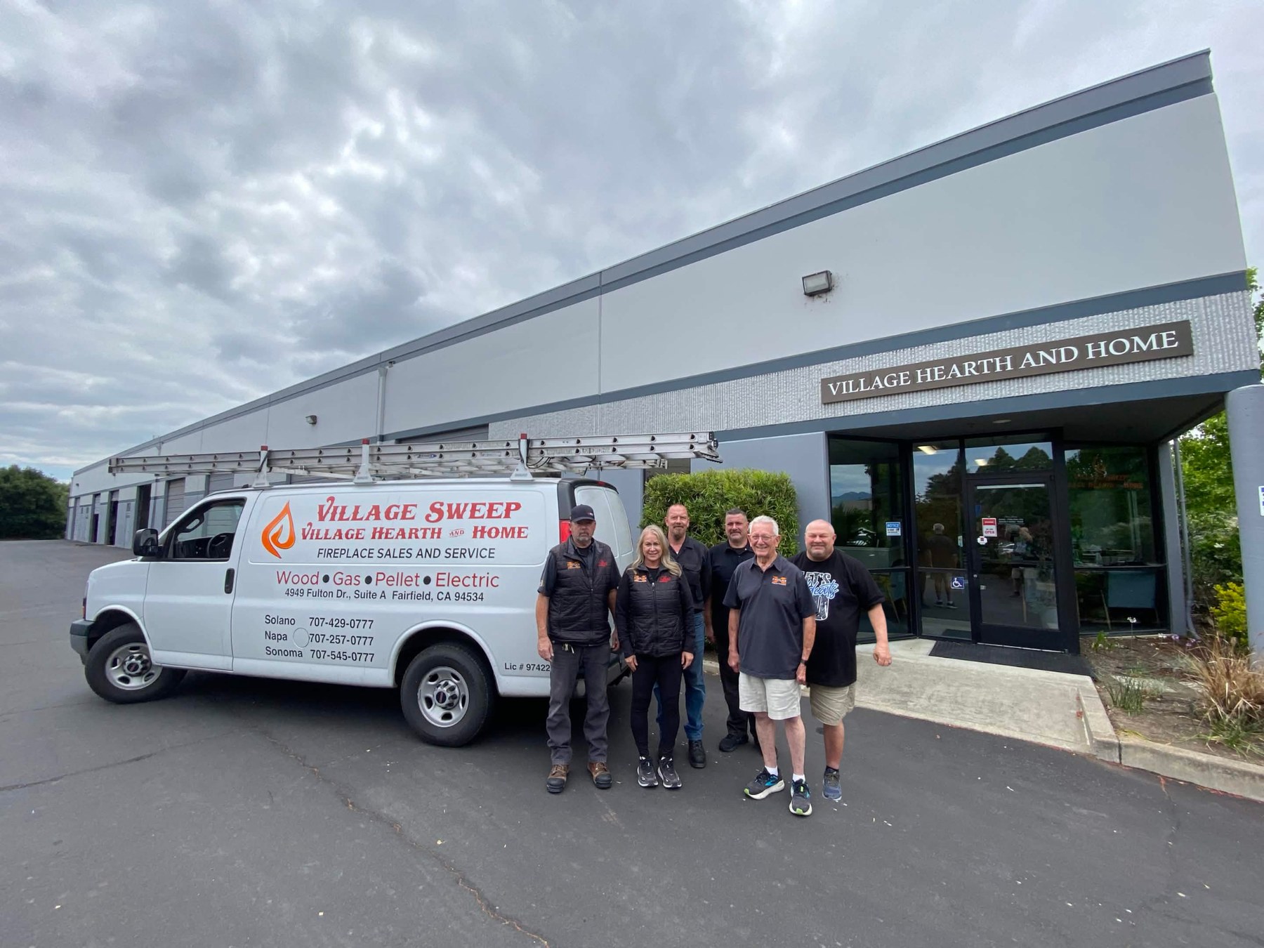 Village Sweep & Village Hearth and Home team in front of the Fairfield showroom with the service van